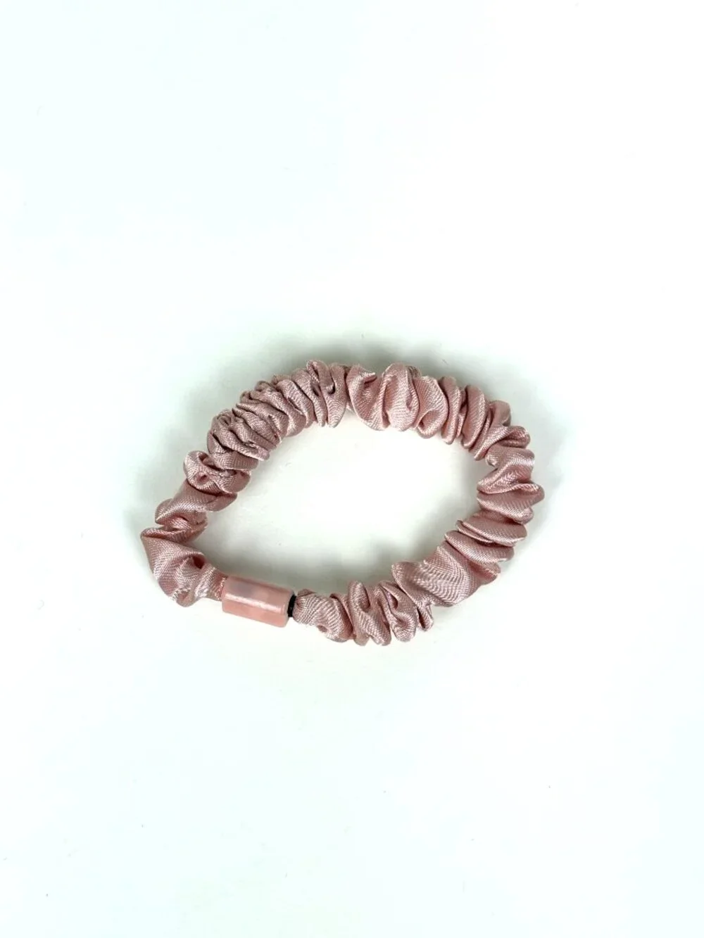 Skinny satin hair scrunchie / skinny hair tie in a light pink / blush shade. New